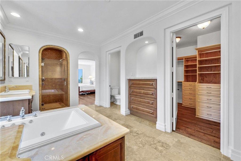 Bathroom, Dual Sink Vanities, Glass Shower, Interior, Recessed Lighting, Wood Texture Flooring