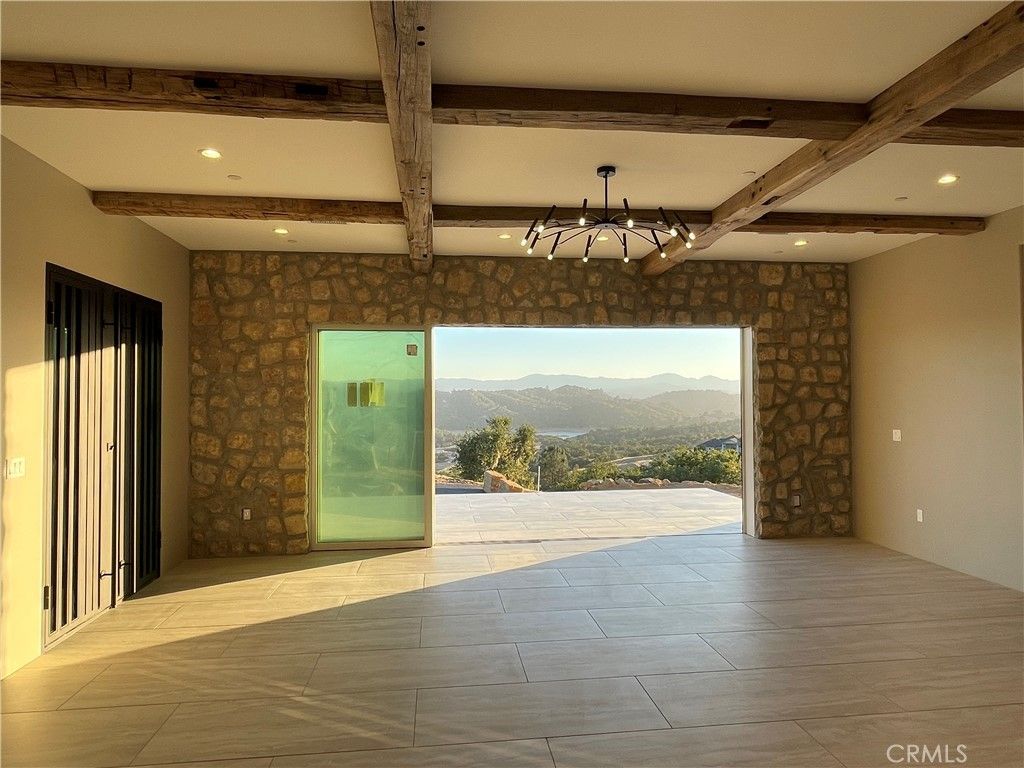 Chandelier, Empty room, Interior, Recessed Lighting, Stone Walls, Wooden Beams