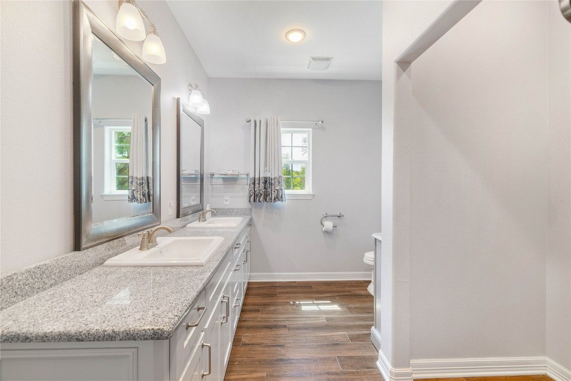 Bathroom, Dual Sink Vanities, Interior, Recessed Lighting, Wood Texture Flooring