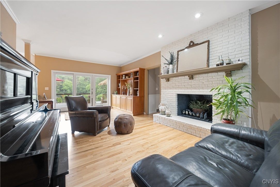 Fireplace, Interior, Living room, Piano, Recessed Lighting, Stone Walls, Wood Texture Flooring