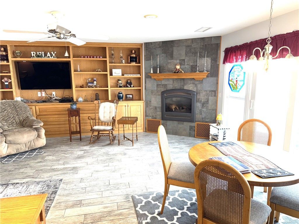 Dining room, Fireplace, Interior, Pendant Lights, Wood Texture Flooring