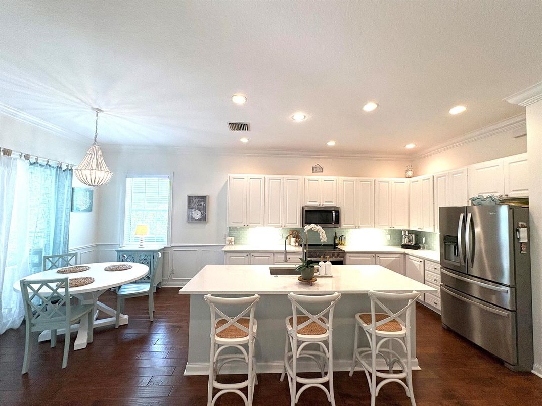 Dining room, Interior, Kitchen, Pendant Lights, Recessed Lighting, Stainless Steel Appliances, Wood Texture Flooring