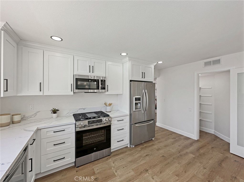 Interior, Kitchen, Recessed Lighting, Stainless Steel Appliances, Wood Texture Flooring