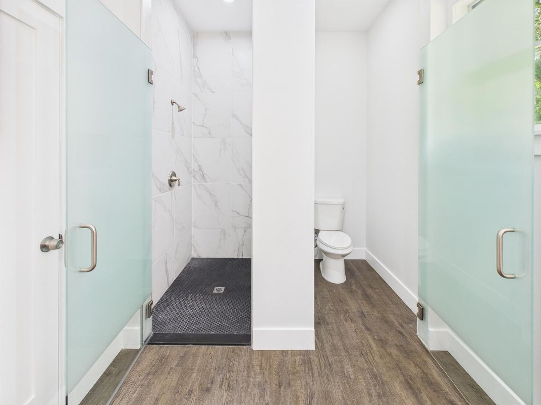 Bathroom, Glass Shower, Interior, Marble Walls, Recessed Lighting, Wood Texture Flooring