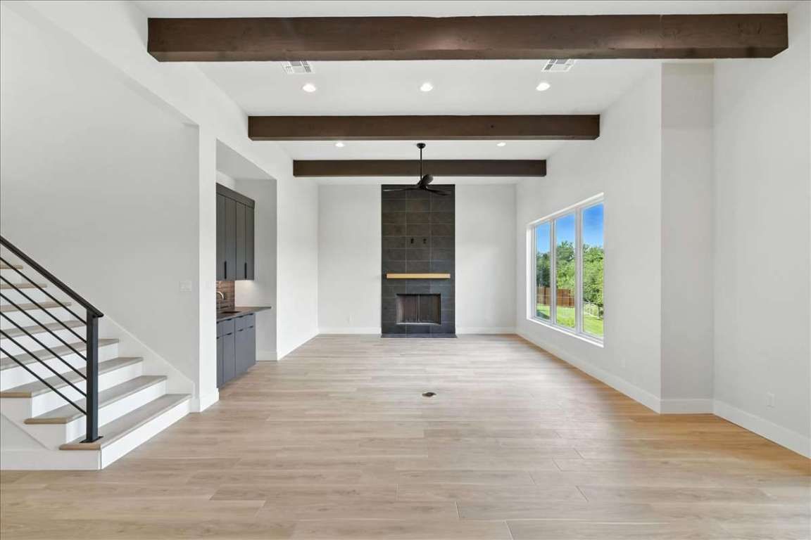 Empty room, Fireplace, Interior, Recessed Lighting, Wooden Beams, Wood Texture Flooring