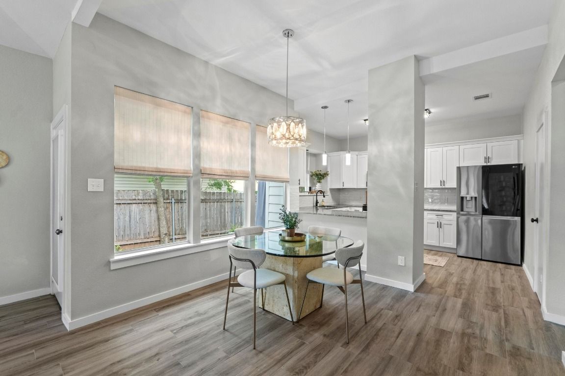 Chandelier, Dining room, Interior, Kitchen, Pendant Lights, Stainless Steel Appliances, Wood Texture Flooring