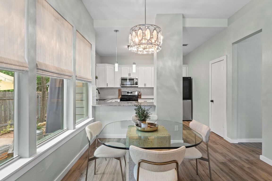 Chandelier, Dining room, Interior, Kitchen, Pendant Lights, Stainless Steel Appliances, Wood Texture Flooring