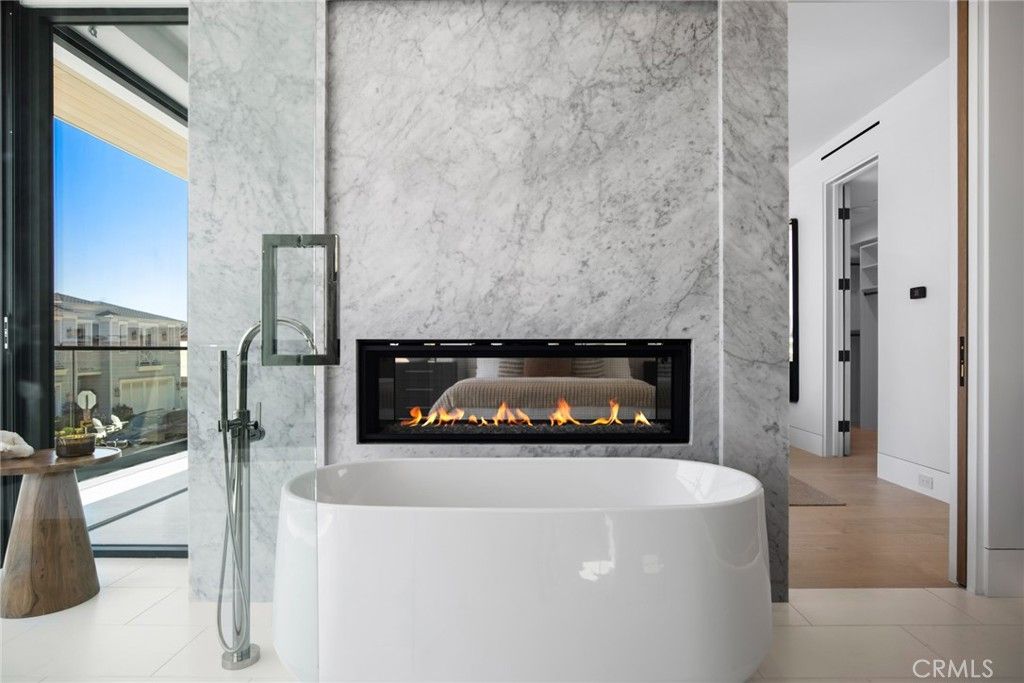 Bathroom, Fireplace, Free Standing Baths, Interior, Marble Walls, Wood Texture Flooring