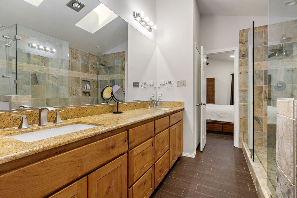 Bathroom, Dual Sink Vanities, Glass Shower, Interior, Recessed Lighting, Wood Texture Flooring