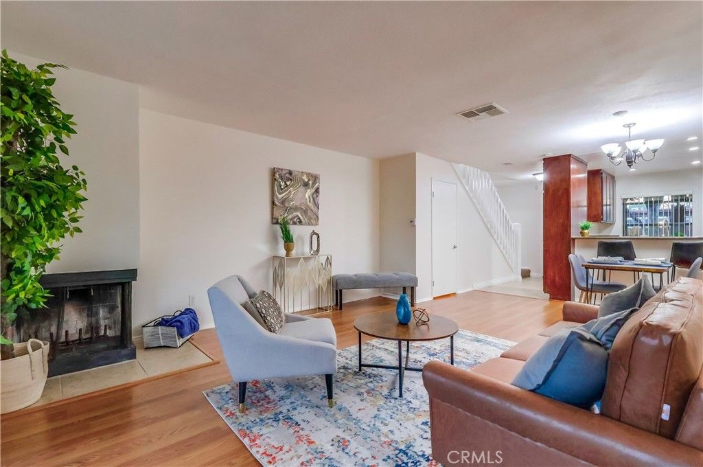 Chandelier, Fireplace, Interior, Living room, Recessed Lighting, Wood Texture Flooring