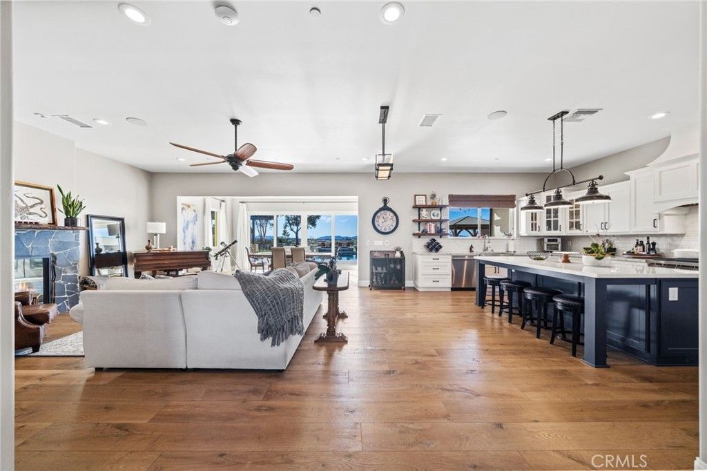 Fireplace, Interior, Kitchen, Living room, Pendant Lights, Recessed Lighting, Stainless Steel Appliances, Wood Texture Flooring