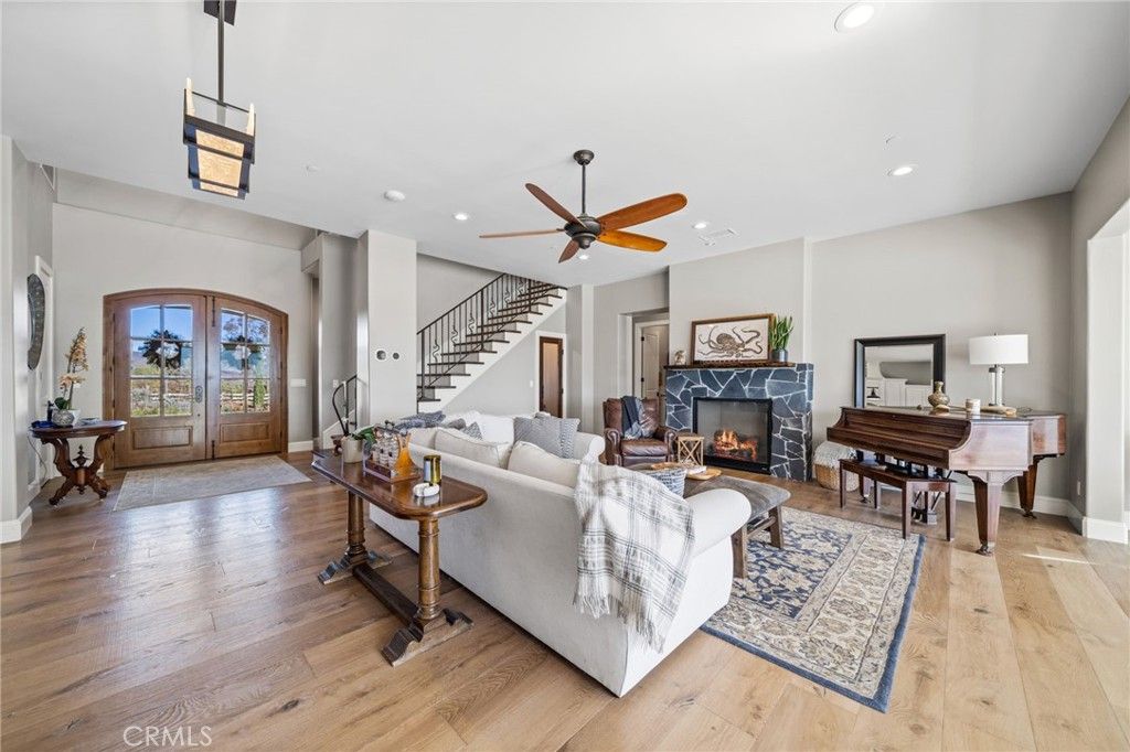 Fireplace, Interior, Living room, Pendant Lights, Piano, Recessed Lighting, Wood Texture Flooring