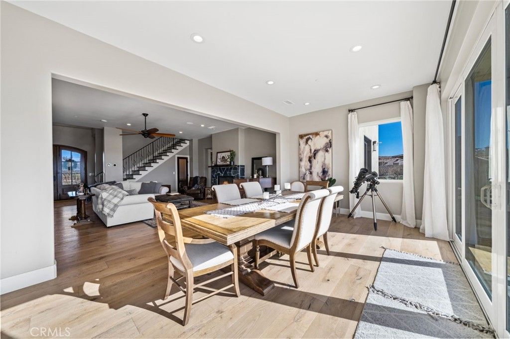 Dining room, Fireplace, Interior, Living room, Recessed Lighting, Wood Texture Flooring