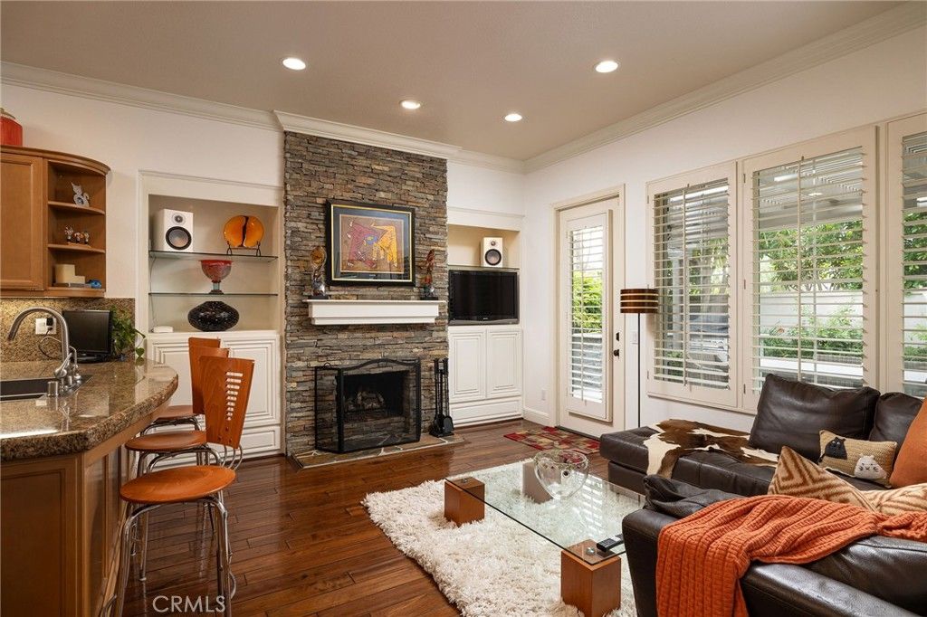Fireplace, Interior, Living room, Recessed Lighting, Stone Walls, Wood Texture Flooring