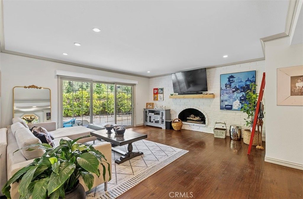 Fireplace, Interior, Living room, Recessed Lighting, Stone Walls, Wood Texture Flooring