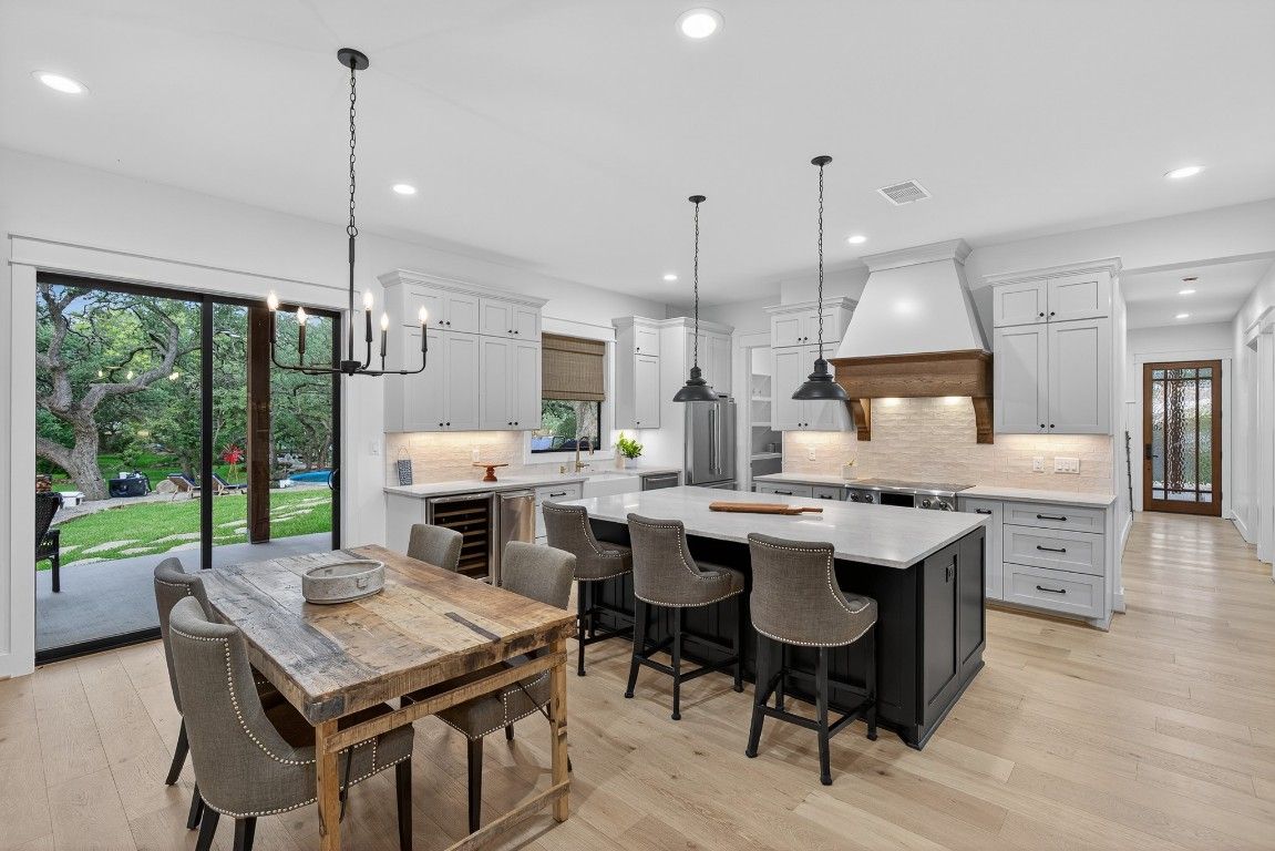 Dining room, Interior, Kitchen, Pendant Lights, Recessed Lighting, Stainless Steel Appliances, Wood Texture Flooring