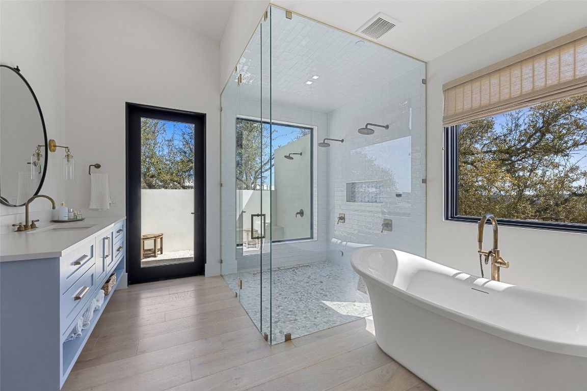 Bathroom, Free Standing Baths, Glass Shower, Interior, Recessed Lighting, Wood Texture Flooring