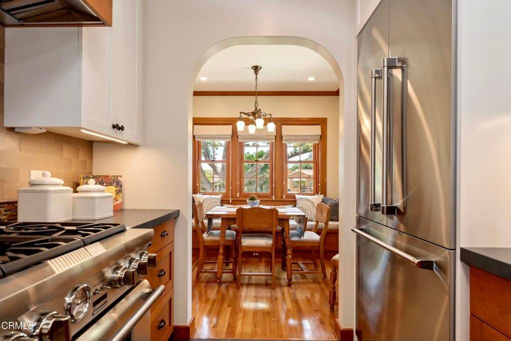 Chandelier, Dining room, Interior, Kitchen, Pendant Lights, Recessed Lighting, Stainless Steel Appliances, Wood Texture Flooring