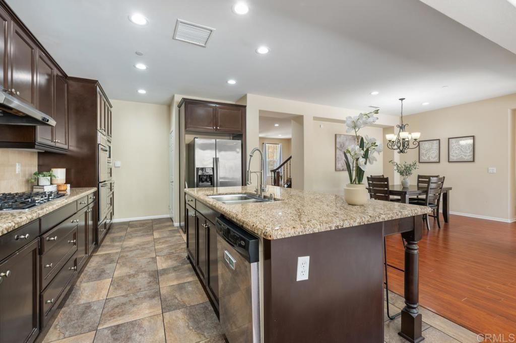 Chandelier, Dining room, Interior, Kitchen, Recessed Lighting, Stainless Steel Appliances, Wood Texture Flooring