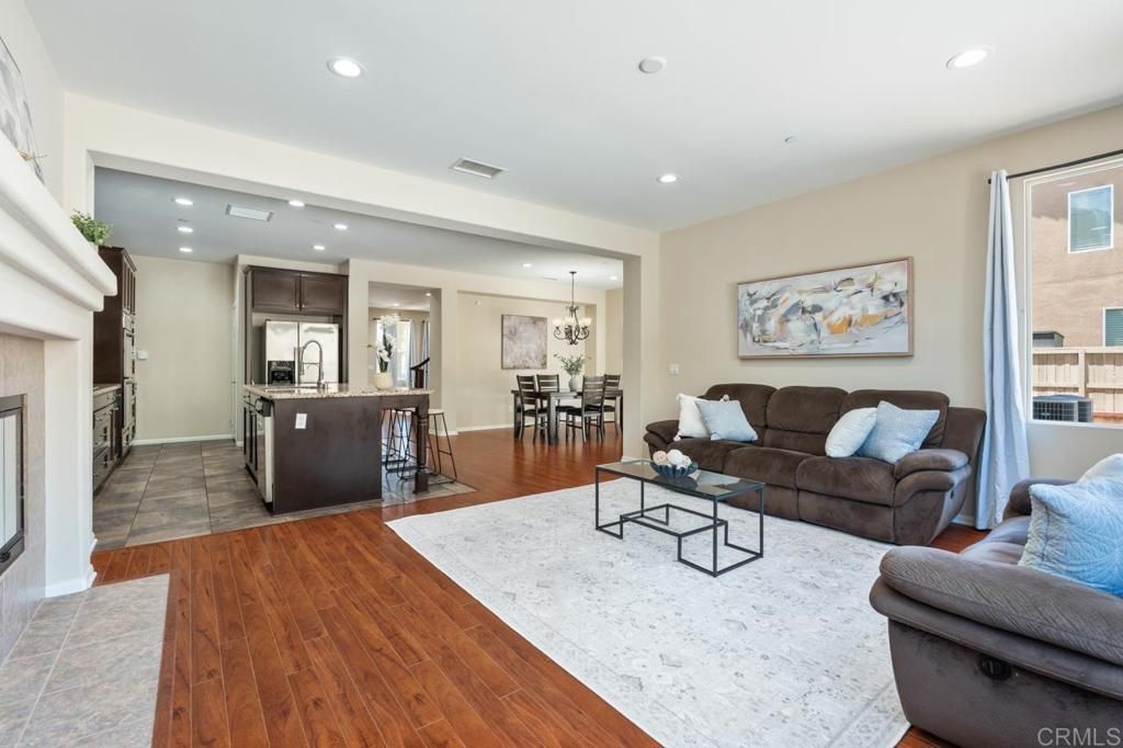 Chandelier, Dining room, Fireplace, Interior, Kitchen, Living room, Pendant Lights, Recessed Lighting, Wood Texture Flooring