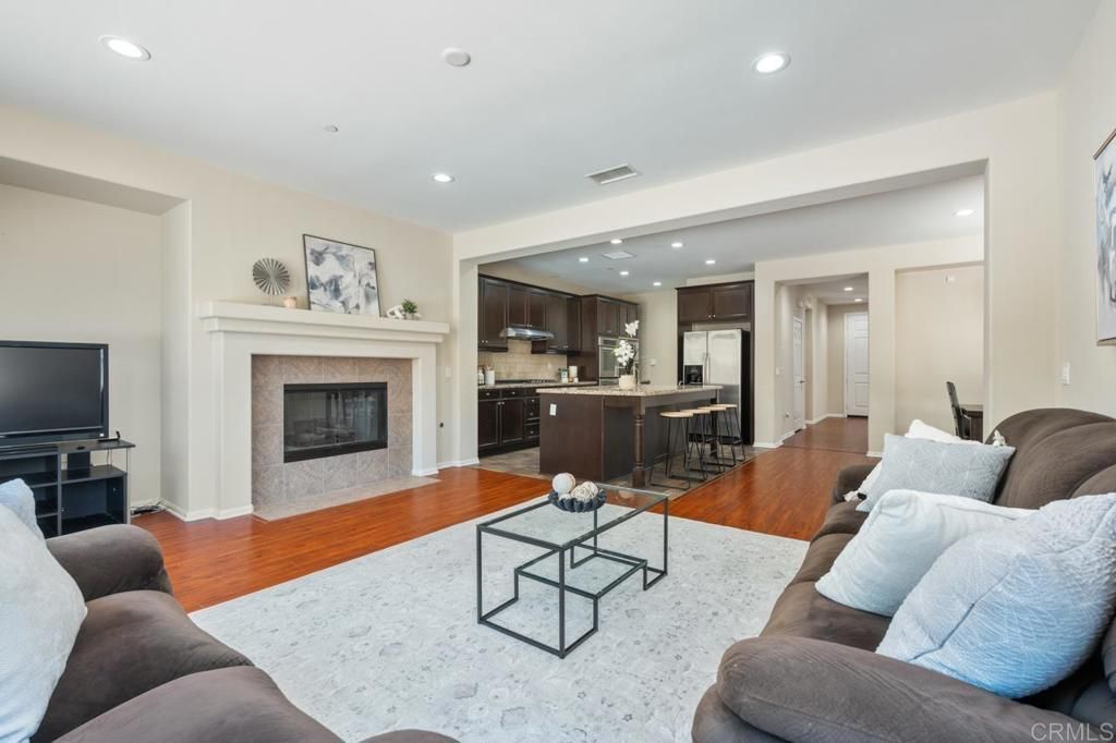 Fireplace, Interior, Kitchen, Living room, Recessed Lighting, Stainless Steel Appliances, Wood Texture Flooring