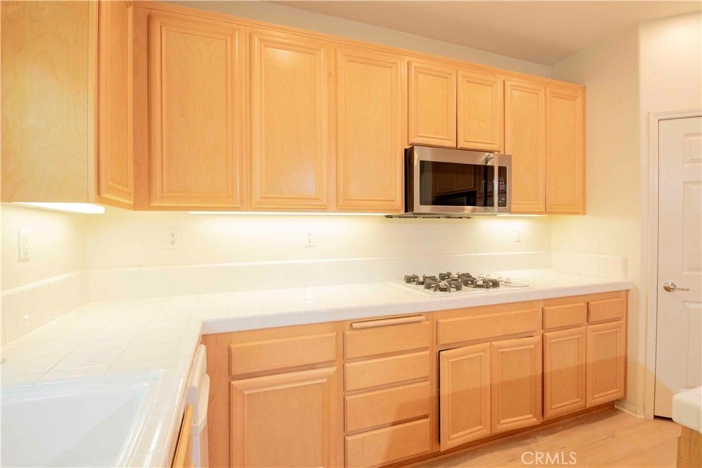 Interior, Kitchen, Tile Countertops, Wood Texture Flooring