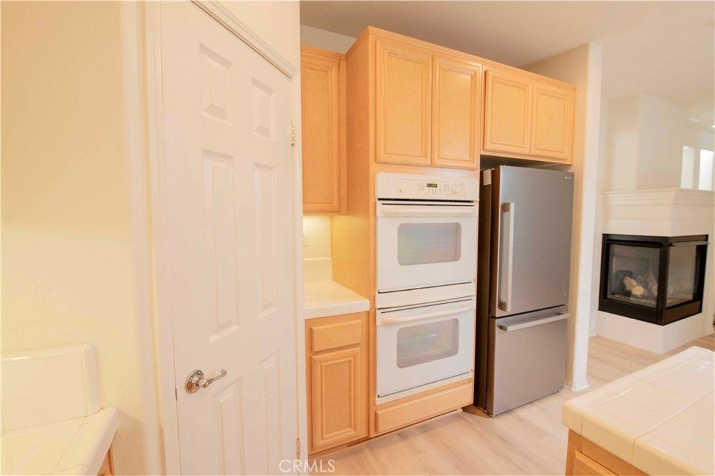 Fireplace, Interior, Kitchen, Tile Countertops, Wood Texture Flooring