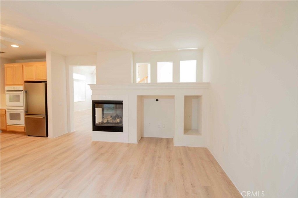 Empty room, Fireplace, Interior, Kitchen, Recessed Lighting, Wood Texture Flooring