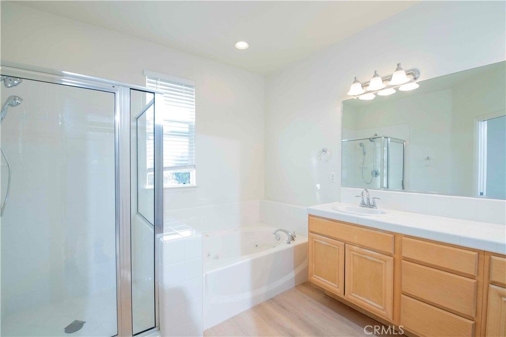 Bathroom, Dual Sink Vanities, Glass Shower, Interior, Recessed Lighting, Wood Texture Flooring