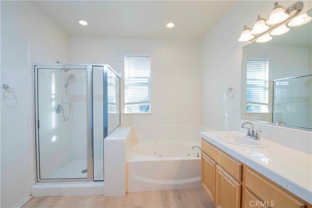 Bathroom, Glass Shower, Interior, Recessed Lighting, Tile Countertops, Wood Texture Flooring