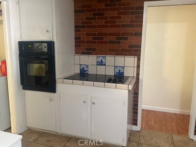 Interior, Kitchen, Stone Walls, Tile Countertops, Wood Texture Flooring