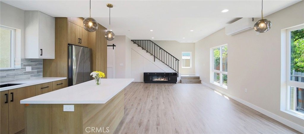 Fireplace, Interior, Kitchen, Pendant Lights, Recessed Lighting, Stainless Steel Appliances, Wood Texture Flooring