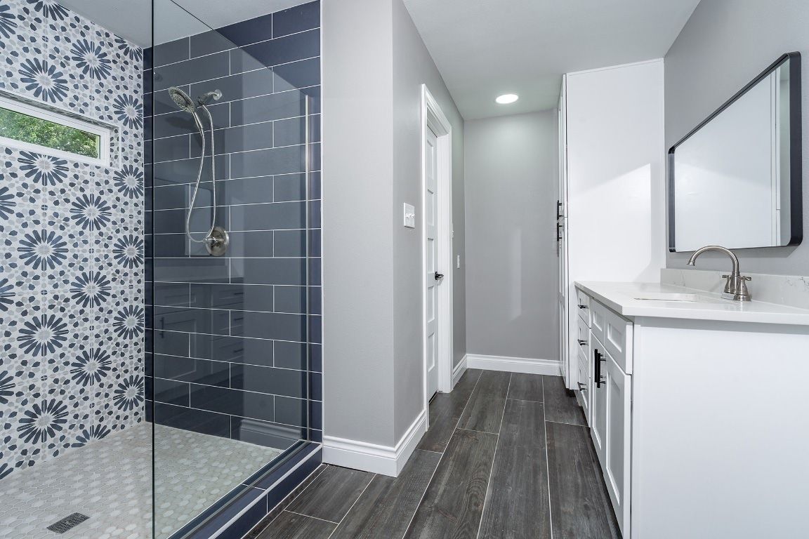 Bathroom, Dual Sink Vanities, Glass Shower, Interior, Recessed Lighting, Wood Texture Flooring