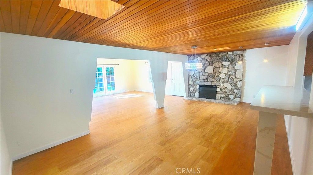 Empty room, Fireplace, Interior, Stone Walls, Wooden Ceilings, Wood Texture Flooring