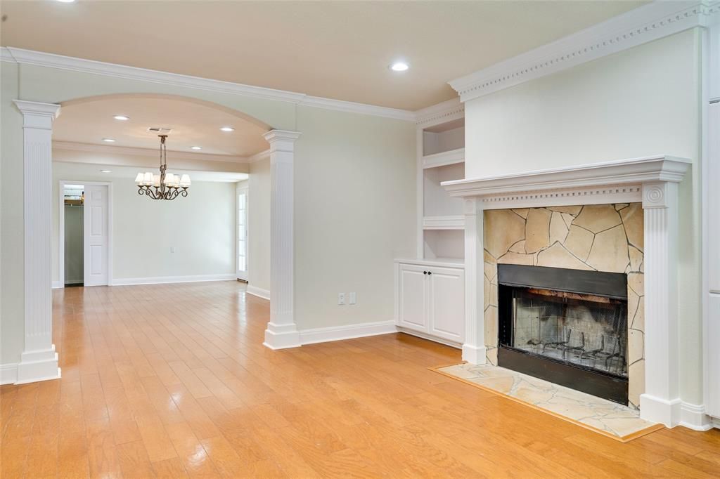 Chandelier, Empty room, Fireplace, Interior, Recessed Lighting, Wood Texture Flooring