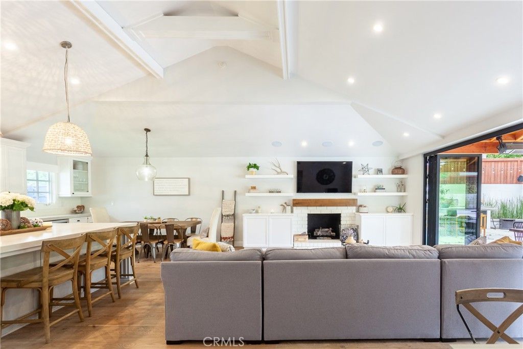 Dining room, Fireplace, Interior, Living room, Pendant Lights, Recessed Lighting, Wood Texture Flooring