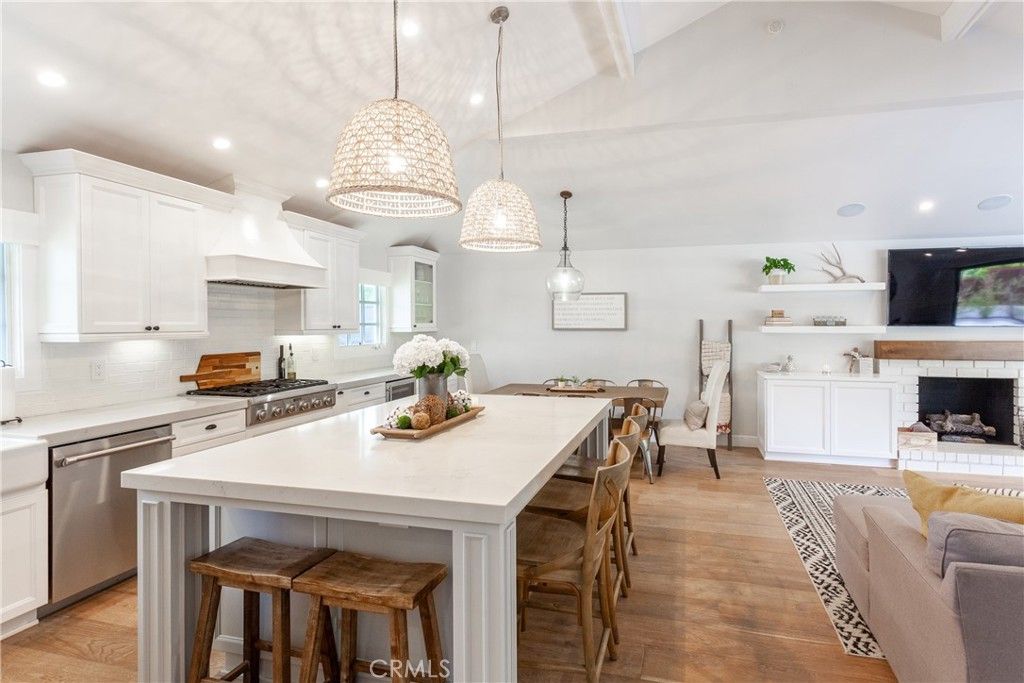 Dining room, Fireplace, Interior, Kitchen, Pendant Lights, Recessed Lighting, Stainless Steel Appliances, Wood Texture Flooring