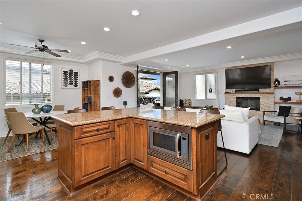 Dining room, Fireplace, Interior, Living room, Recessed Lighting, Wood Texture Flooring
