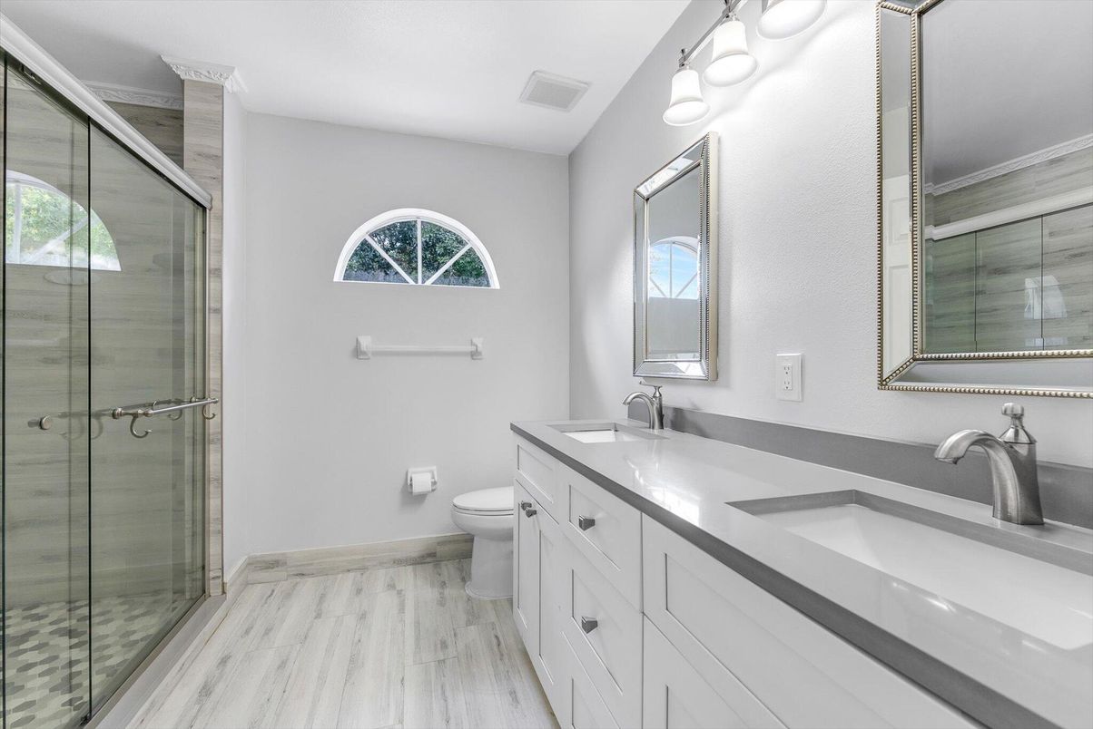 Bathroom, Dual Sink Vanities, Glass Shower, Interior, Wood Texture Flooring