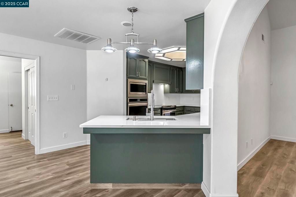 Interior, Kitchen, Pendant Lights, Stainless Steel Appliances, Wood Texture Flooring