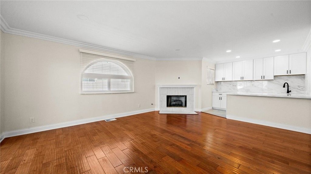 Empty room, Fireplace, Interior, Kitchen, Marble Walls, Recessed Lighting, Wood Texture Flooring