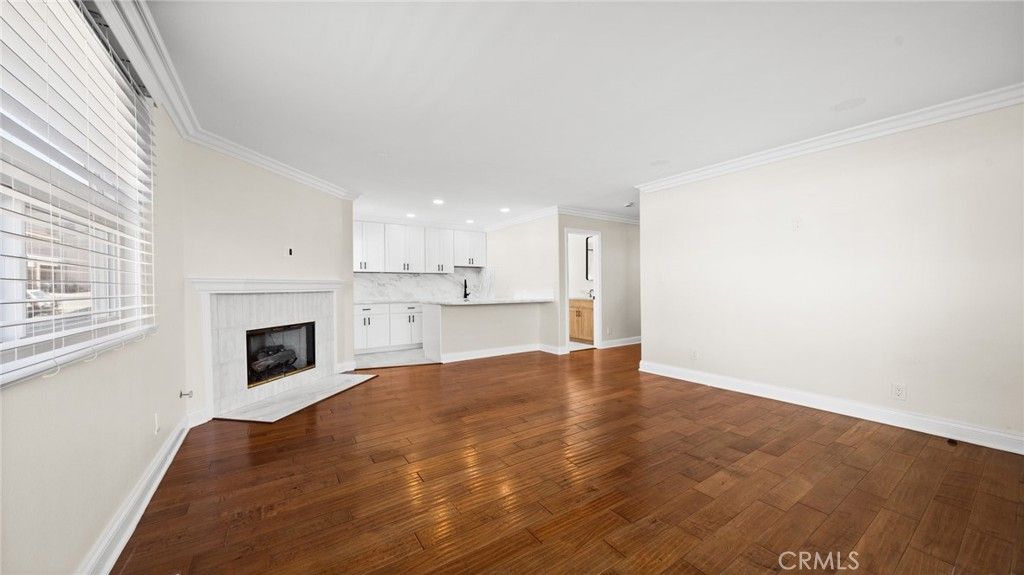 Empty room, Fireplace, Interior, Kitchen, Pendant Lights, Recessed Lighting, Wood Texture Flooring