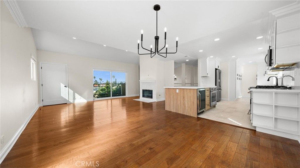 Chandelier, Empty room, Fireplace, Interior, Kitchen, Pendant Lights, Recessed Lighting, Wood Texture Flooring