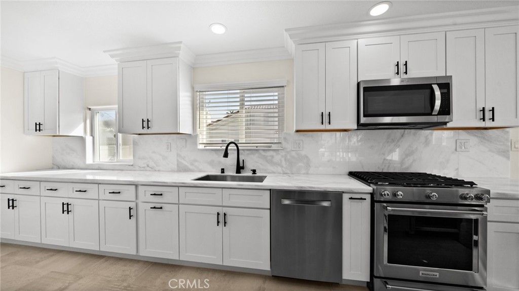Interior, Kitchen, Marble Walls, Recessed Lighting, Stainless Steel Appliances, Wood Texture Flooring