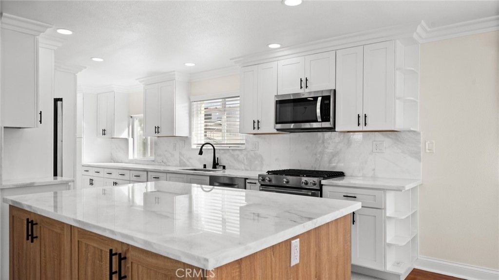 Interior, Kitchen, Marble Walls, Recessed Lighting, Stainless Steel Appliances