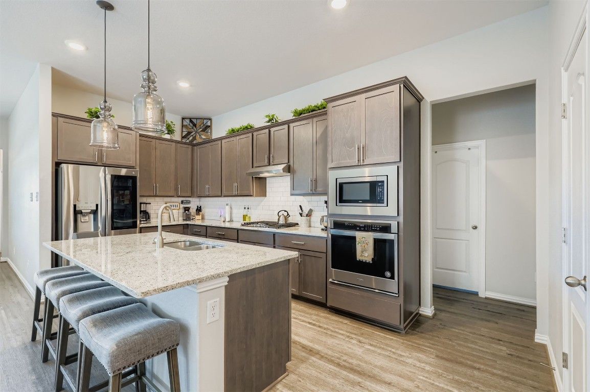 Interior, Kitchen, Pendant Lights, Recessed Lighting, Stainless Steel Appliances, Wood Texture Flooring