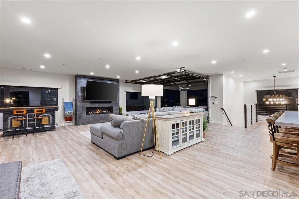 Dining room, Fireplace, Interior, Living room, Pendant Lights, Recessed Lighting, Wood Texture Flooring