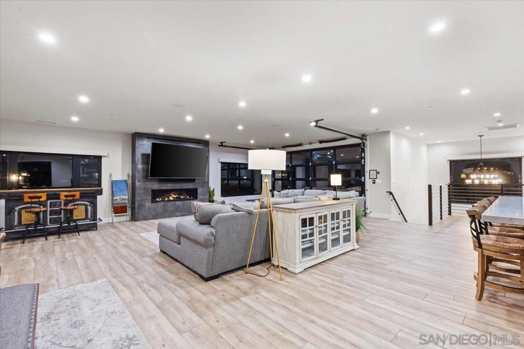 Dining room, Fireplace, Interior, Living room, Pendant Lights, Recessed Lighting, Wood Texture Flooring