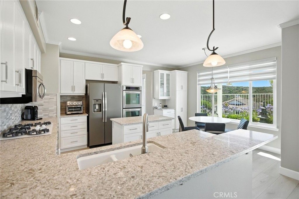 Dining room, Interior, Kitchen, Pendant Lights, Recessed Lighting, Stainless Steel Appliances, Water, Wood Texture Flooring