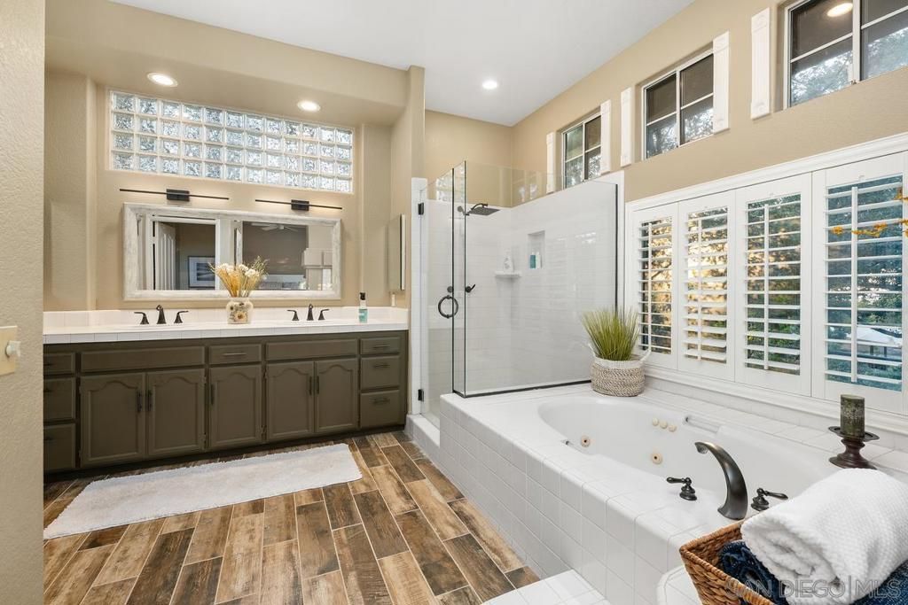 Bathroom, Dual Sink Vanities, Glass Shower, Interior, Recessed Lighting, Wood Texture Flooring